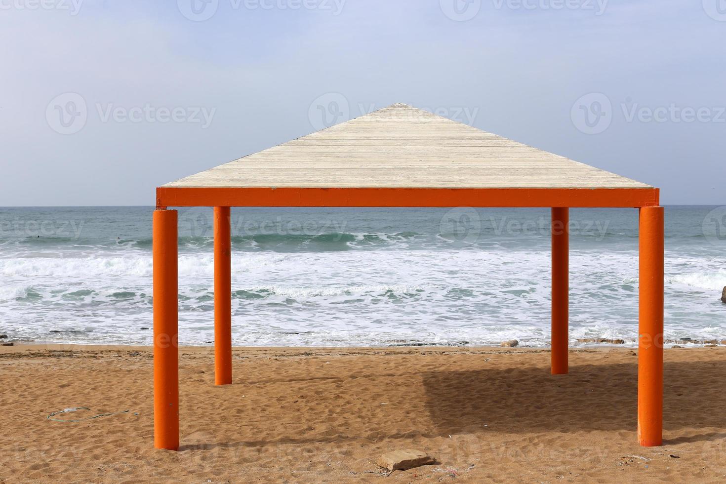 Canopy from the scorching sun on the seashore. photo