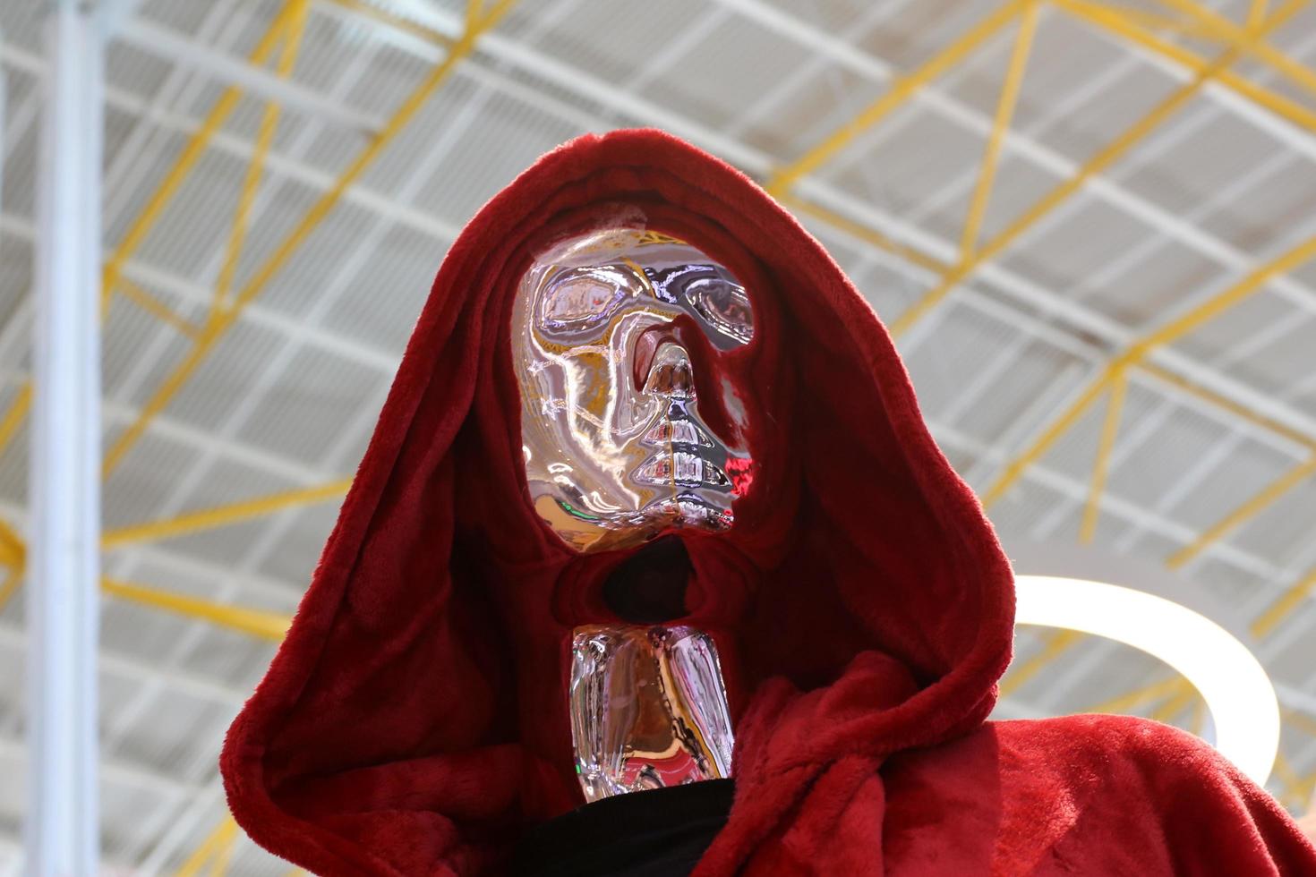 A mannequin stands on a showcase in a store. photo