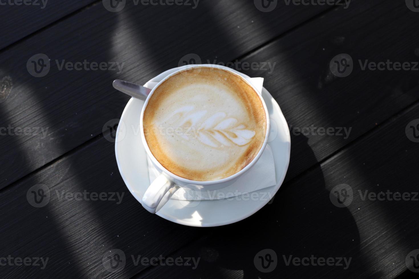 On the table in the restaurant strong and hot coffee. photo
