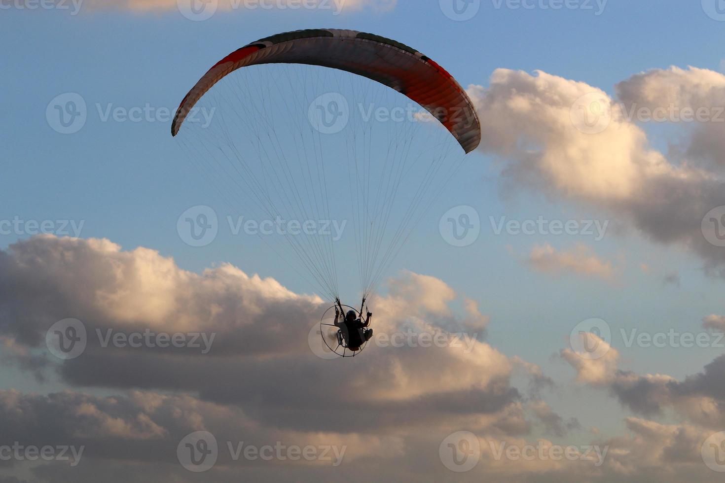 Paragliding in the sky over the Mediterranean Sea. photo