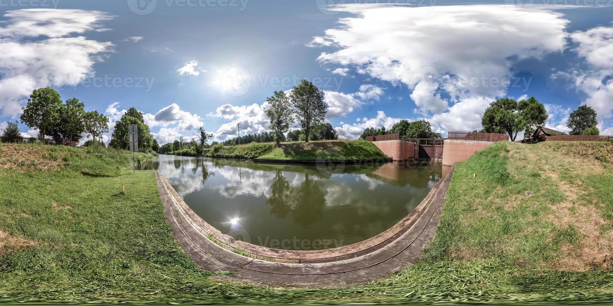 Full spherical seamless hdri panorama 360 degrees angle view near gateway lock sluice construction on river, canal for passing vessels at different water levels in equirectangular projection photo