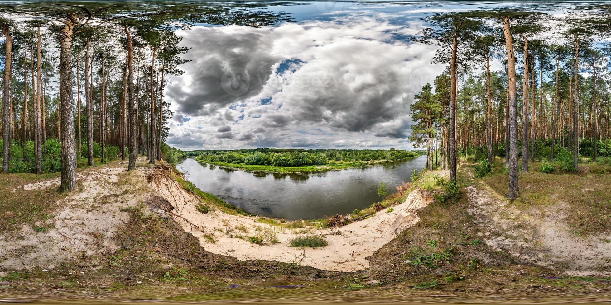 full seamless spherical hdri panorama 360 degrees angle view on high bank of wide river neman near pinery forest in windy day with beautiful clouds in equirectangular projection, ready VR AR content photo