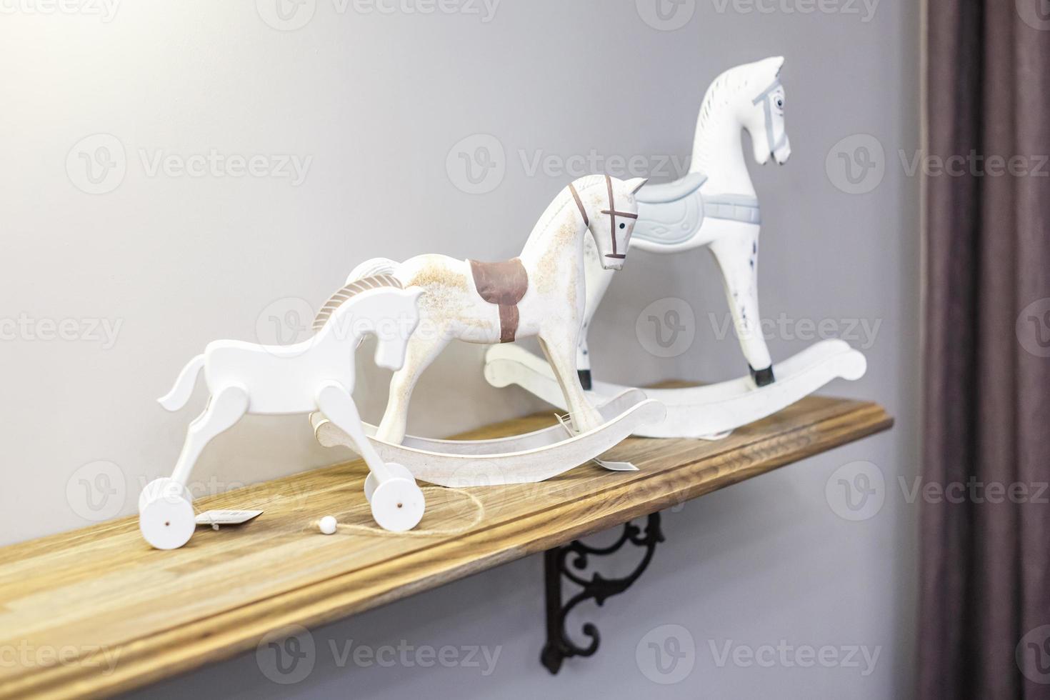 interior decoration toys. White decorative ceramic horses in expensive interior photo