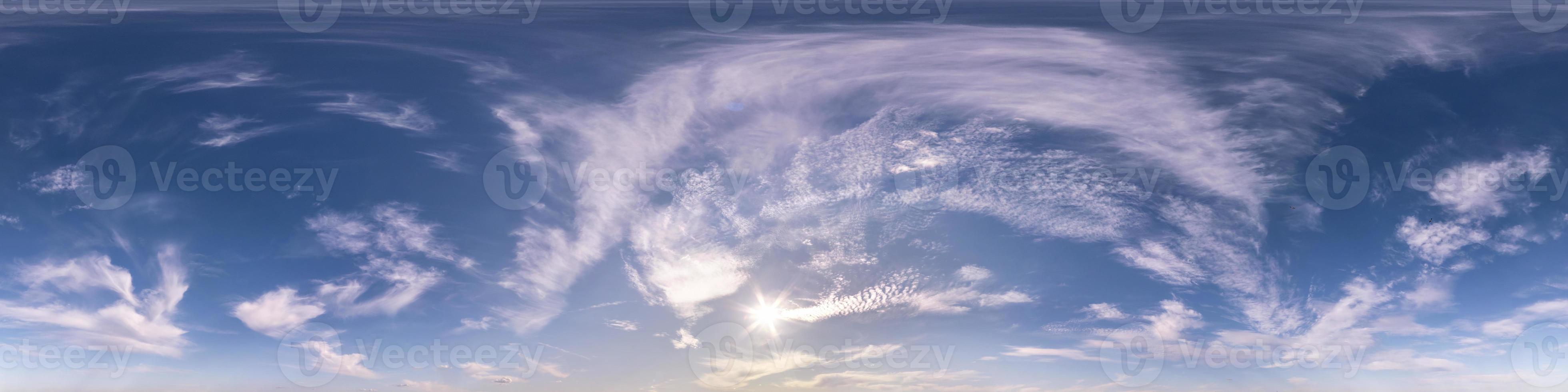 blue sky with beautiful fluffy cumulus clouds. Seamless hdri panorama 360 degrees angle view without ground for use in 3d graphics or game development as sky dome or edit drone shot photo