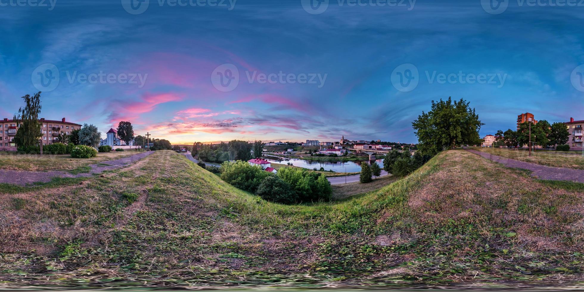 full seamless spherical hdri panorama 360 degrees angle view on bank of wide river overlooking old city in sunset with beautiful clouds in equirectangular projection, ready VR virtual reality content photo
