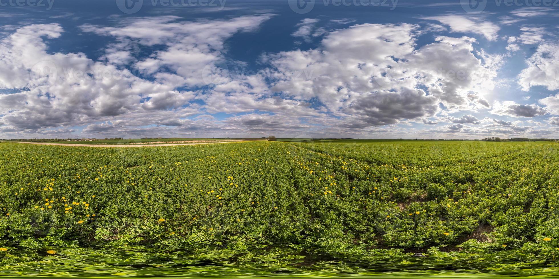 full seamless spherical hdri panorama 360 degrees angle view on among fields in spring evening with awesome clouds in equirectangular projection, ready for VR AR virtual reality content photo