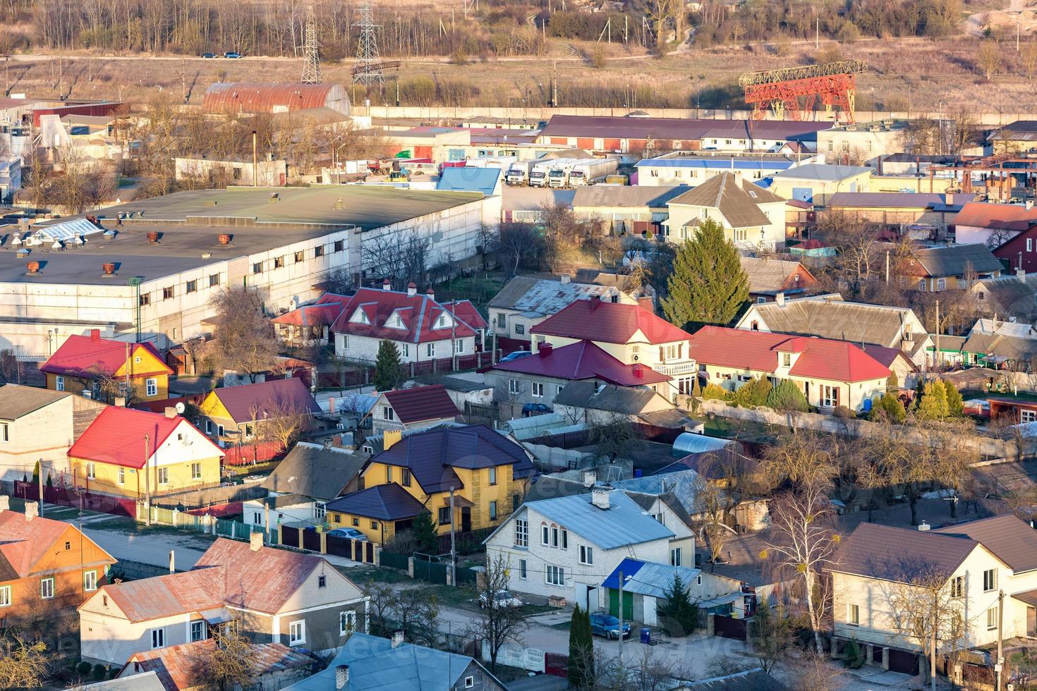 Panoramic view on village building area urban development residential quarter in the evening from a bird's eye view photo