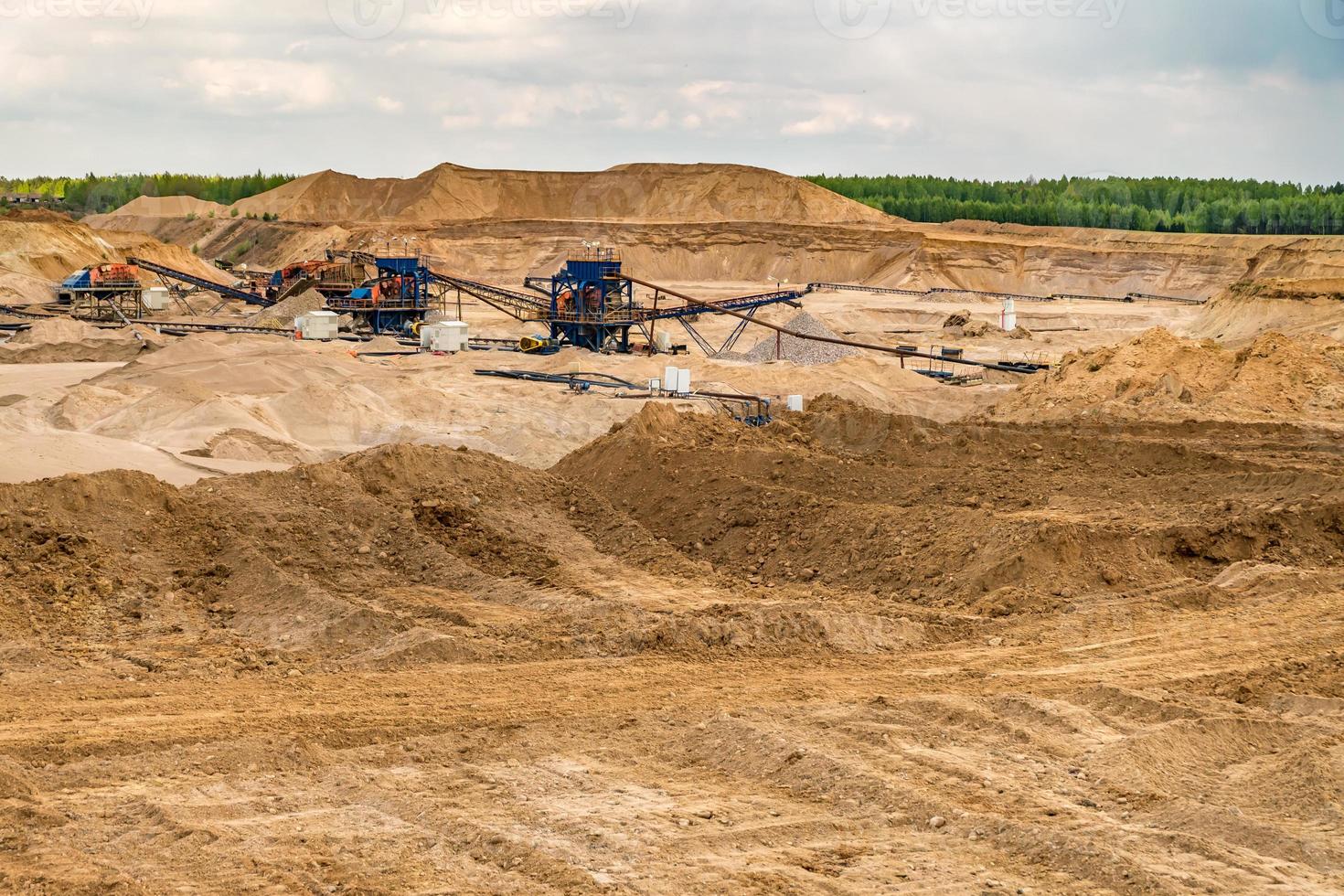 huge digger in quarry  for sand extraction mining photo