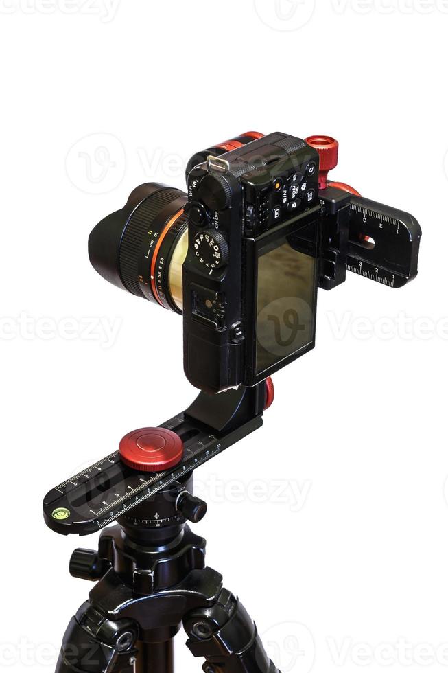panoramic head for a tripod for the making of virtual tours and full seamless 360 degrees angle panoramas without parallax and distortion isolated on white background with mirrorless camera photo