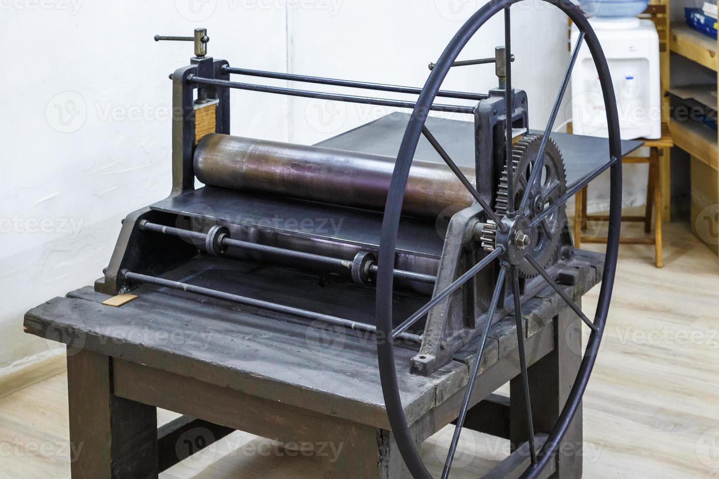 gears mechanism. details of old ancient machine for making engravings photo