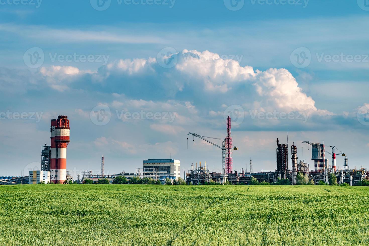 Industrial landscape environmental pollution waste of thermal power plant. Big pipes of chemical industry enterprise plant photo