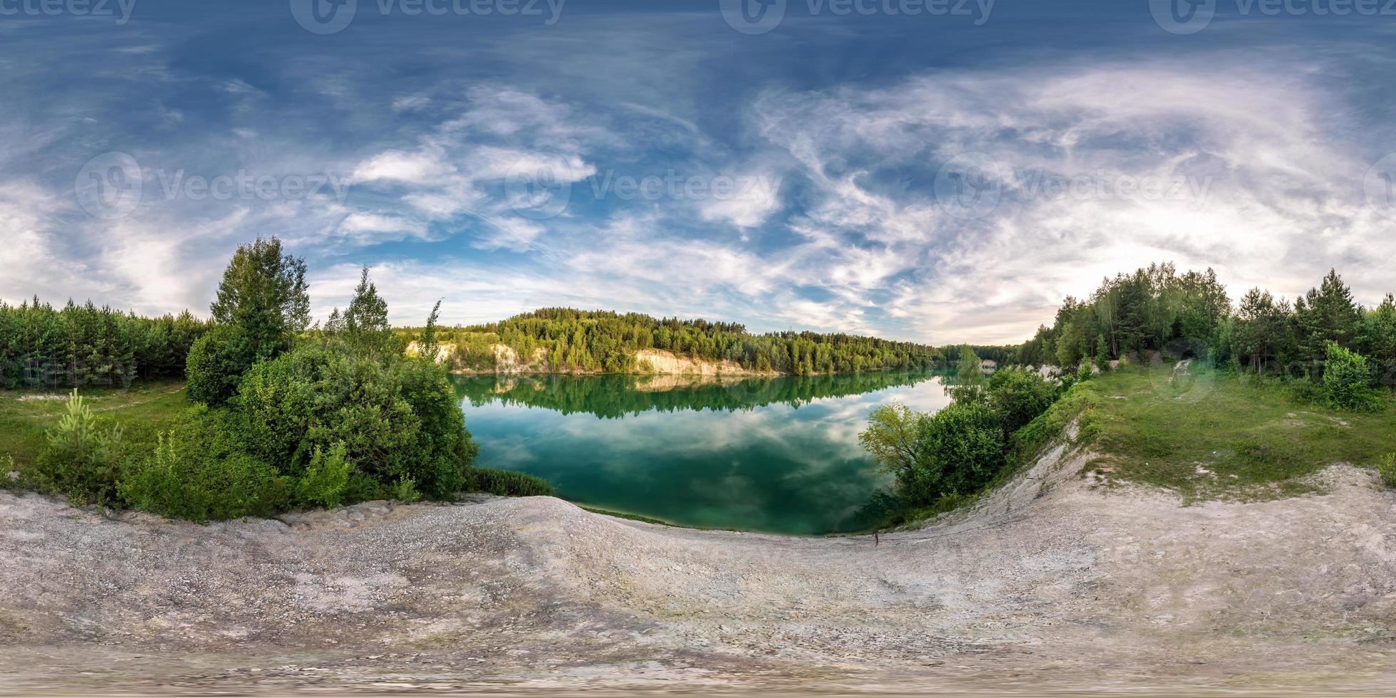full seamless spherical hdri panorama 360 degrees angle view on limestone coast of huge green lake or river near forest in summer day with beautiful clouds in equirectangular projection, VR content photo