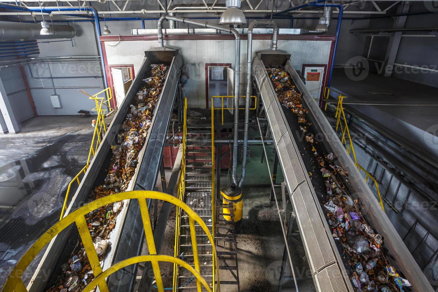 moving conveyor transporter on Modern waste recycling processing plant. Separate and sorting garbage collection. Recycling and storage of waste for further disposal. photo