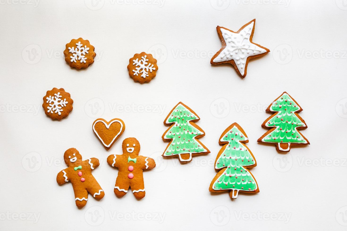 Handmade festive gingerbread cookies in the form of stars and Christmas trees and hearts for Valentine's Day photo
