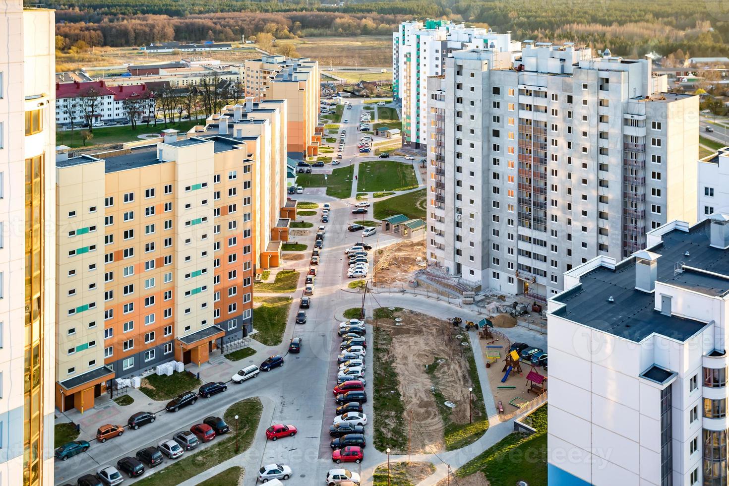 Panoramic view on new quarter high-rise building area urban development residential quarter in the evening from a bird's eye view photo