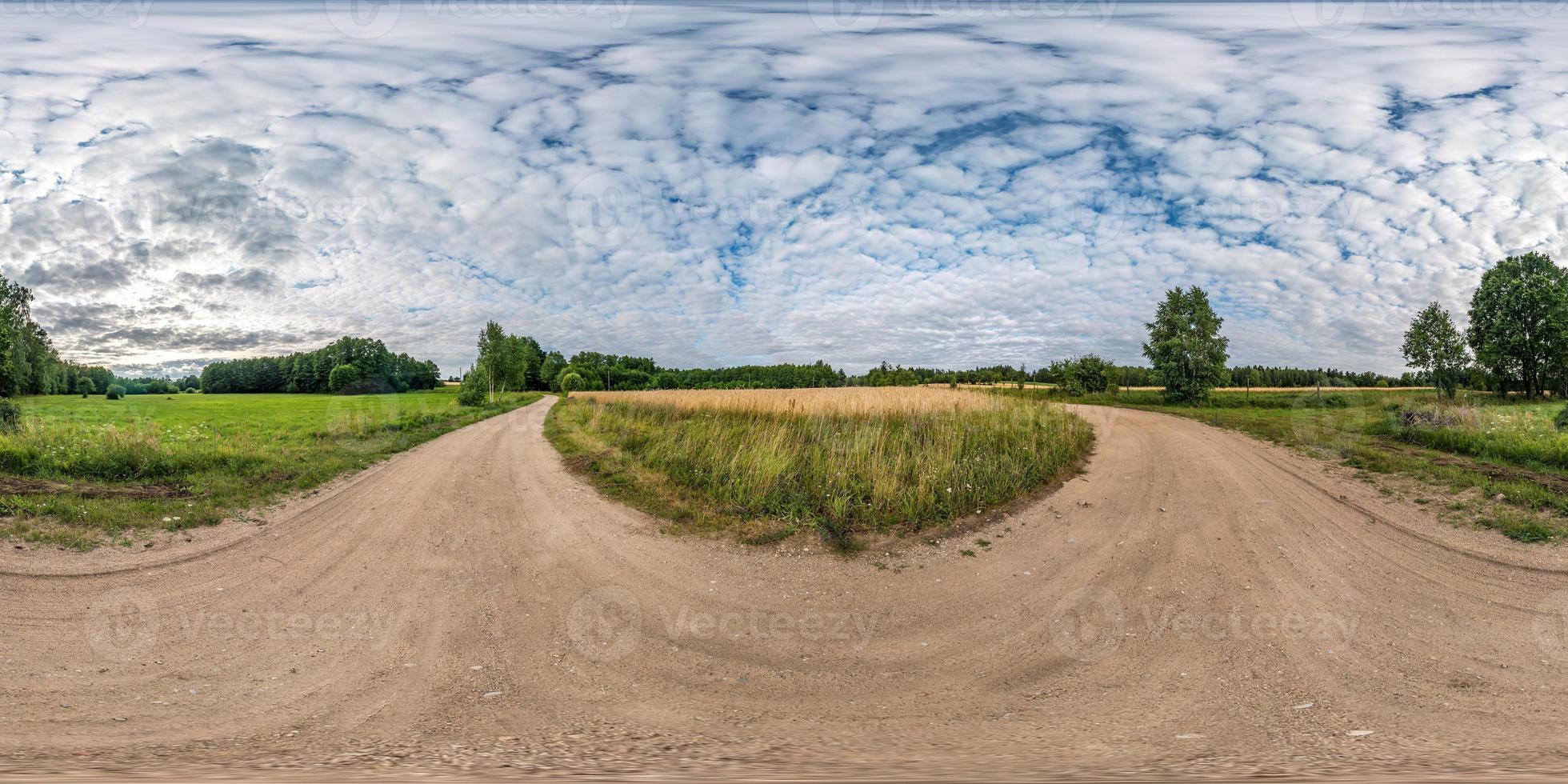 full seamless spherical hdri panorama 360 degrees angle view among fields in summer evening sunset with beautiful clouds in equirectangular projection photo