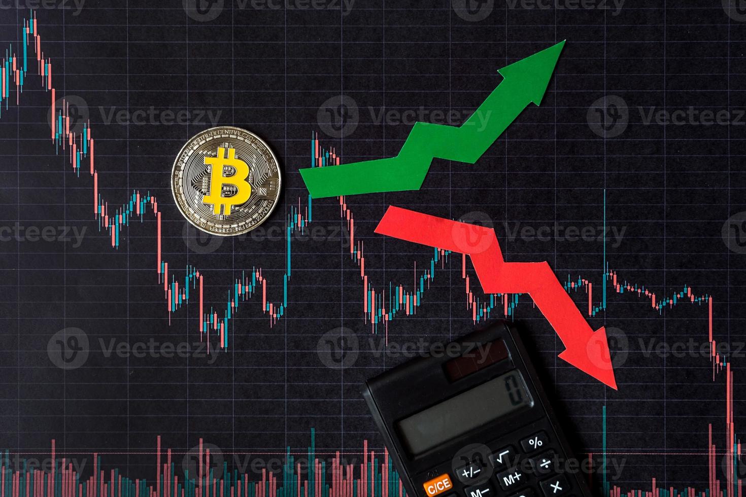 fluctuations  and forecasting of exchange rates of virtual money bitcoin. Red and green arrows with golden Bitcoin ladder on black paper forex chart background with calculator. Cryptocurrency concept. photo