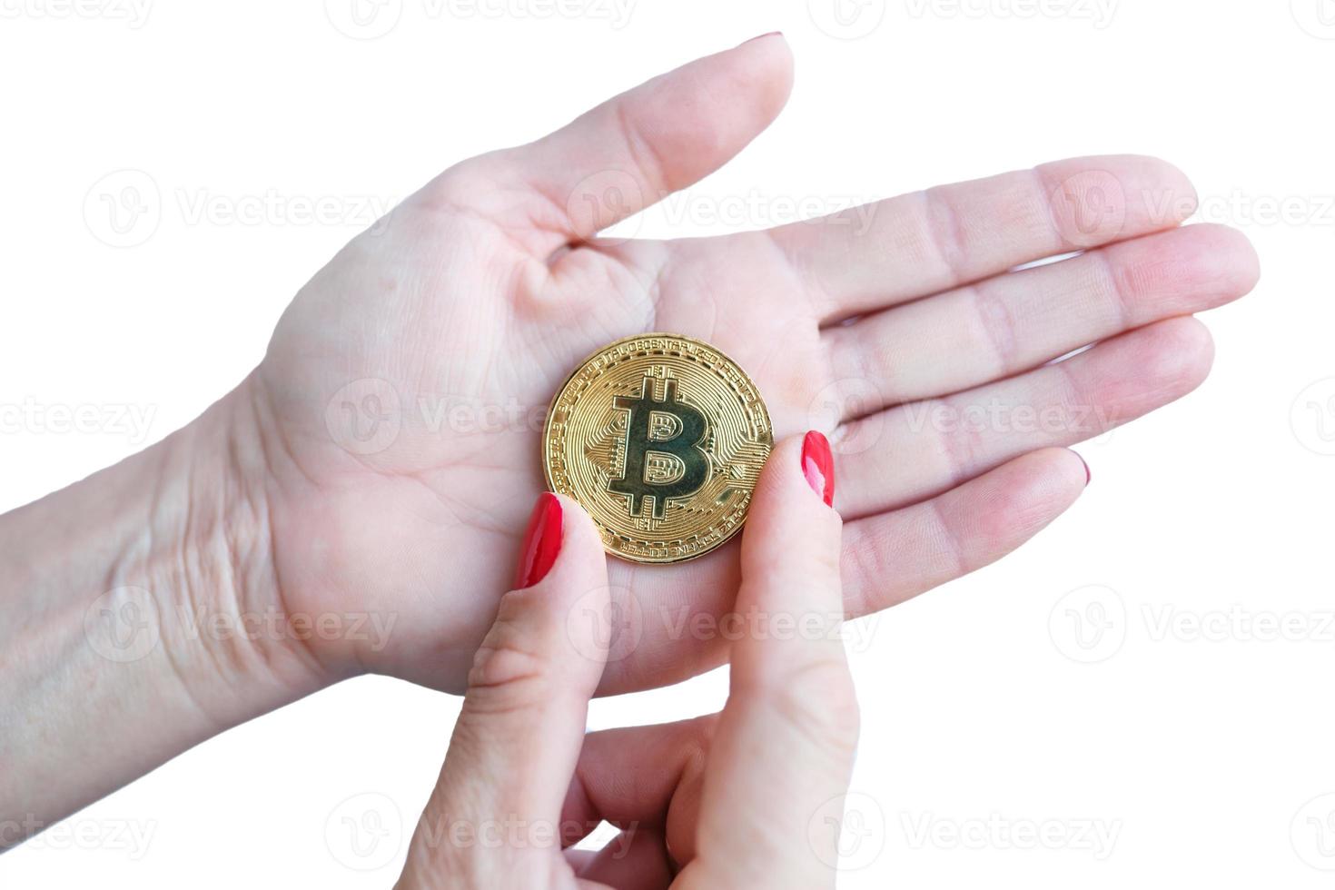 virtual money golden bitcoin women hand with red nails fingers isolated on white background photo