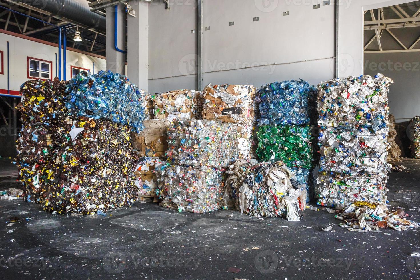 Plastic bales of rubbish at the waste treatment processing plant. Recycling separatee and storage of garbage for further disposal, trash sorting. Business for sorting and processing of waste. photo