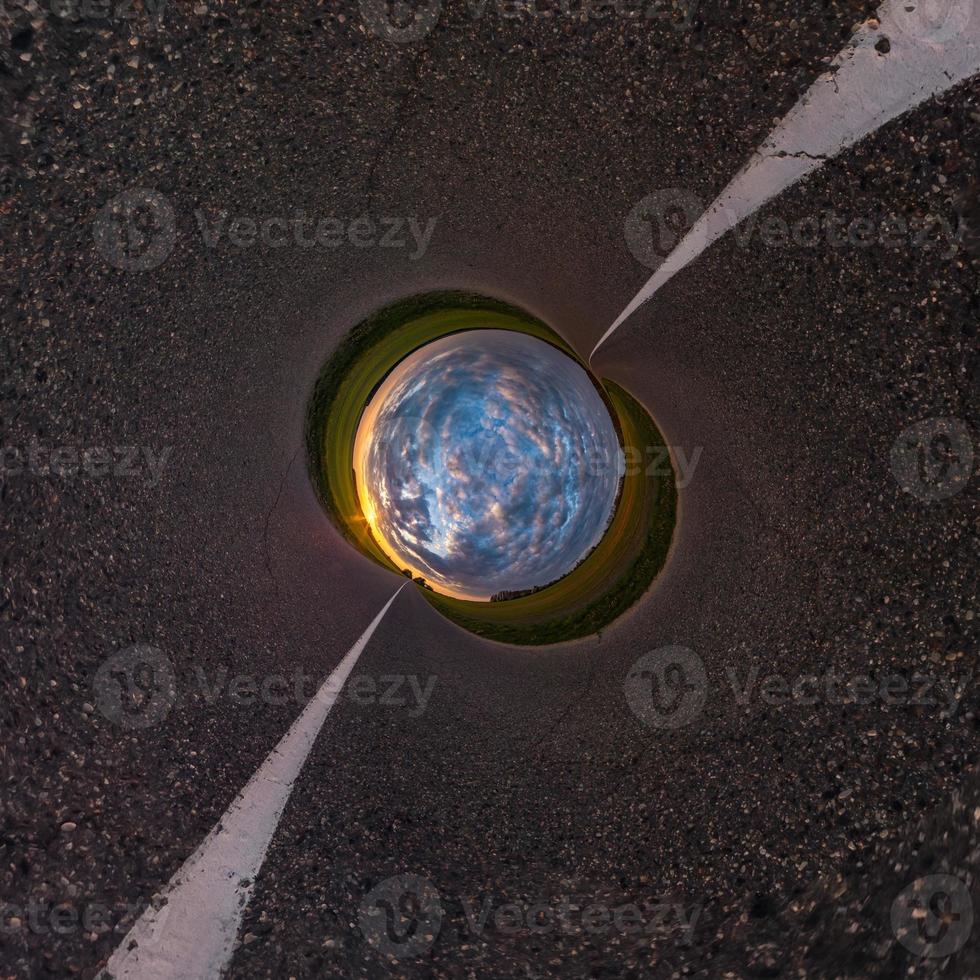 Little planet transformation of spherical panorama 360 degrees. Spherical abstract aerial view in field with awesome beautiful clouds. Curvature of space. photo