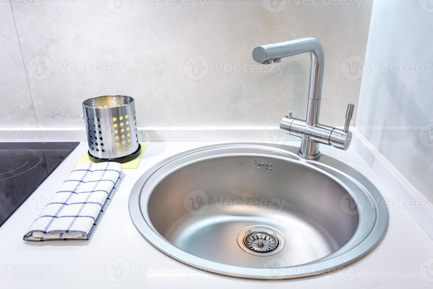 Water tap sink with faucet in expensive loft kitchen photo