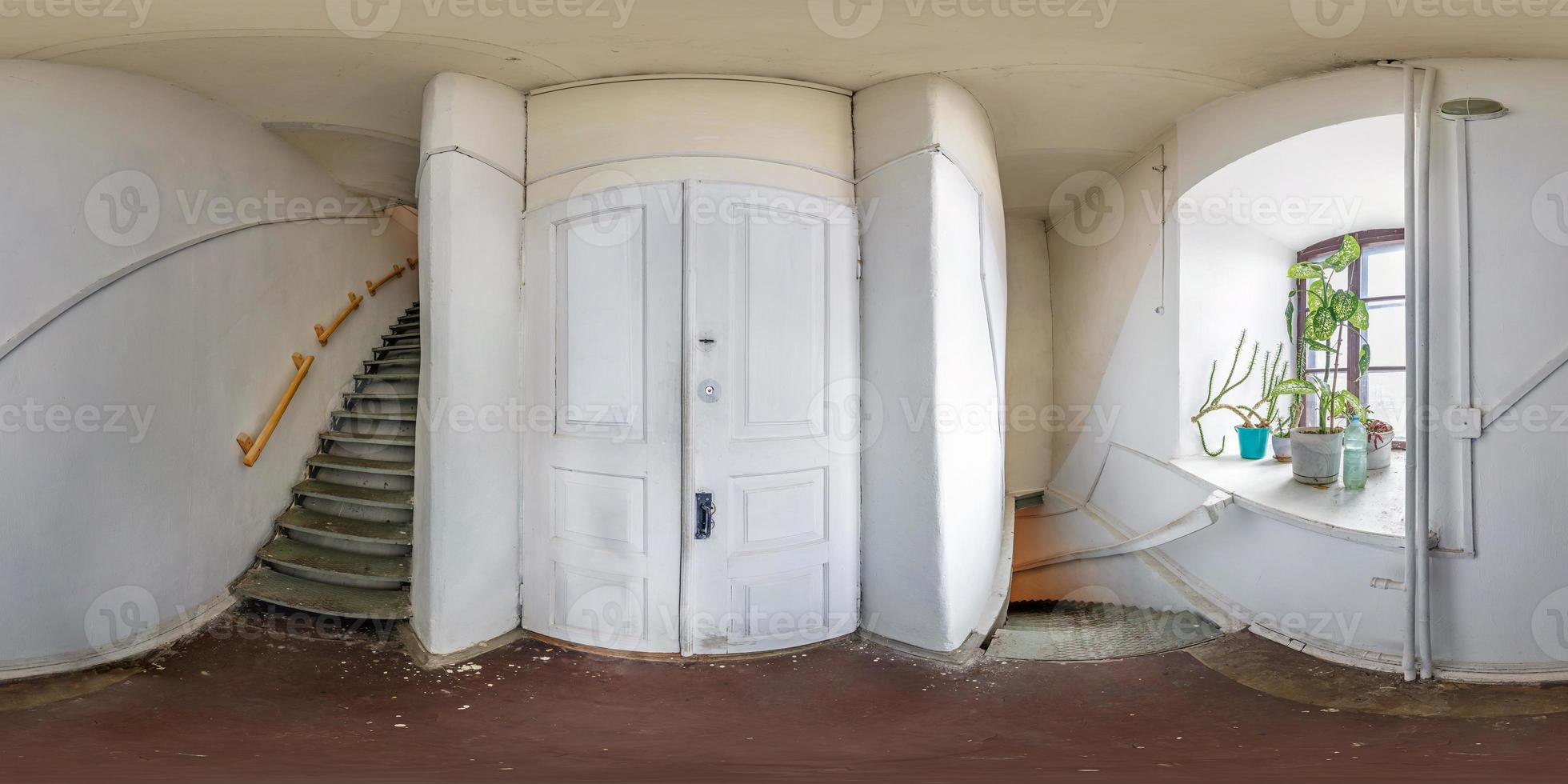 full seamless spherical hdri panorama 360 degrees angle view in interior of white mpty corridor with spiral staircase in equirectangular projection. VR content photo