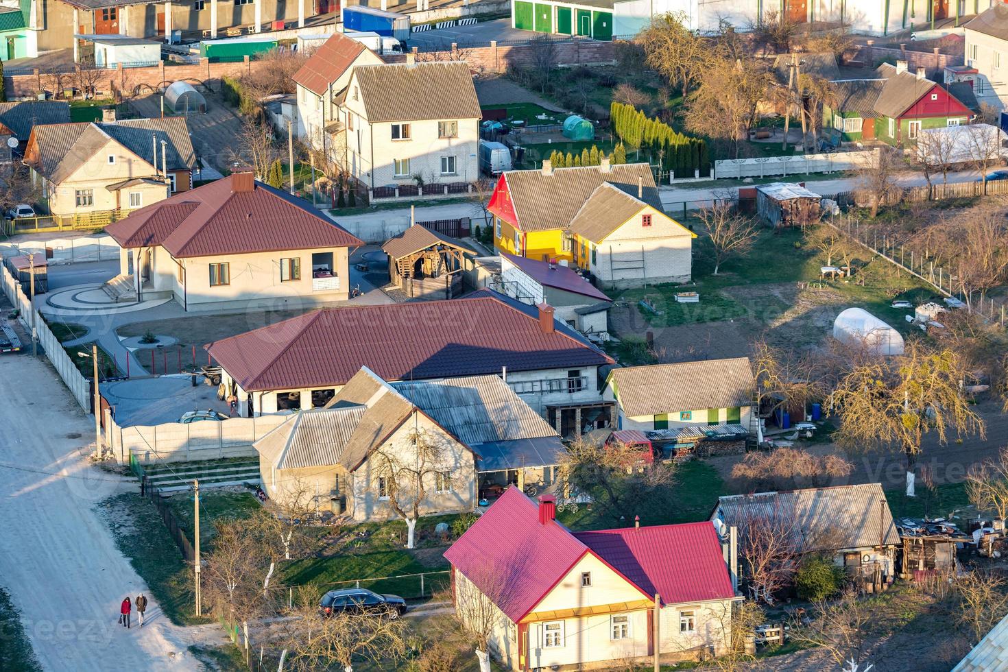 Panoramic view on village building area urban development residential quarter in the evening from a bird's eye view photo