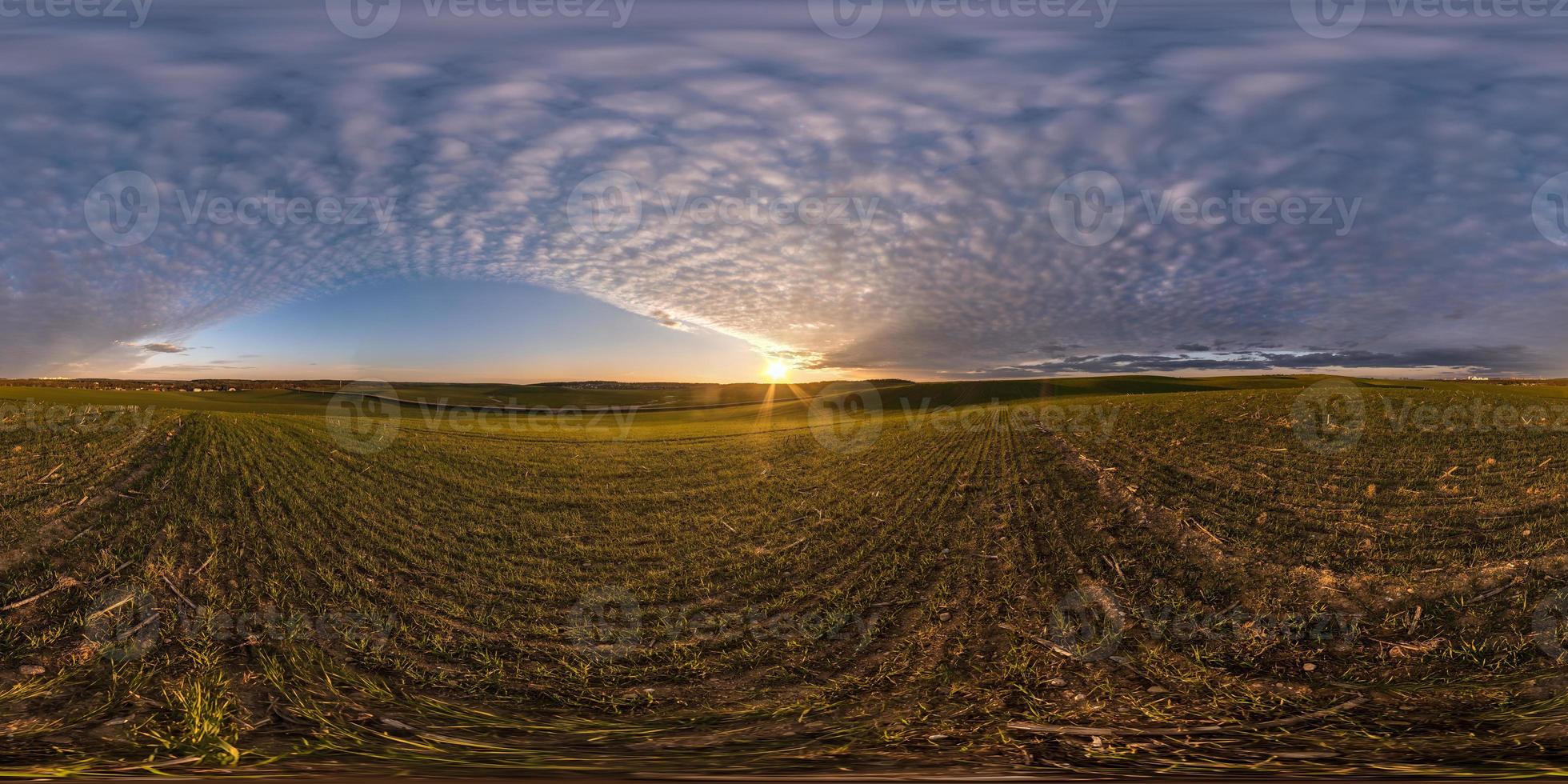 full seamless spherical hdri panorama 360 degrees angle view on among fields in spring evening with awesome clouds in equirectangular projection, ready for VR virtual reality content photo