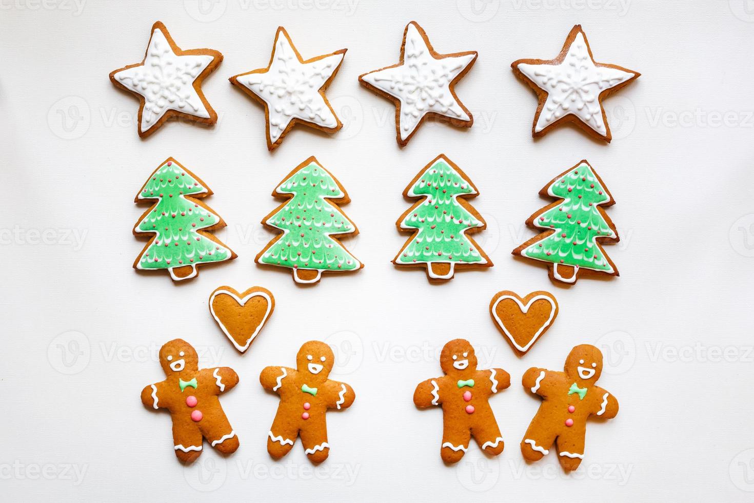 Handmade festive gingerbread cookies in the form of stars and Christmas trees and hearts for Valentine's Day photo