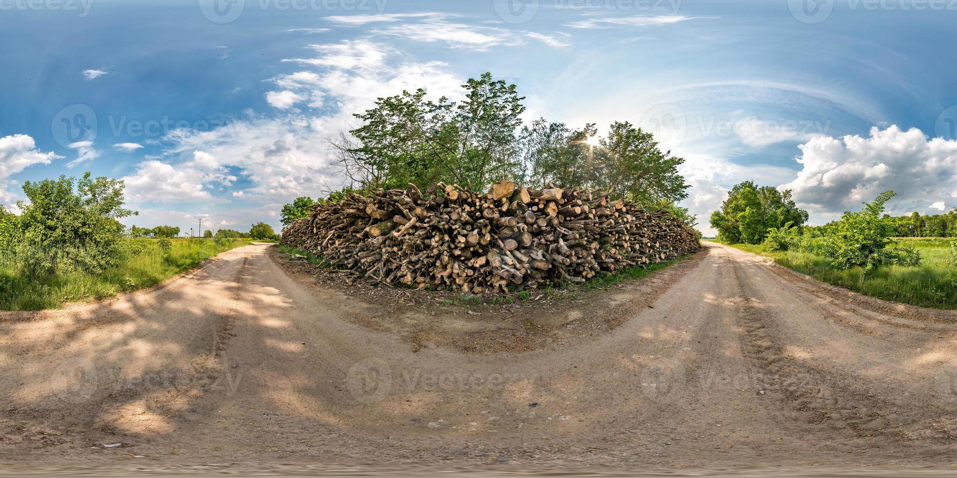 full seamless spherical hdri panorama 360 degrees angle view on gravel road near firewood in summer day with awesome clouds in equirectangular projection, for VR AR virtual reality content photo