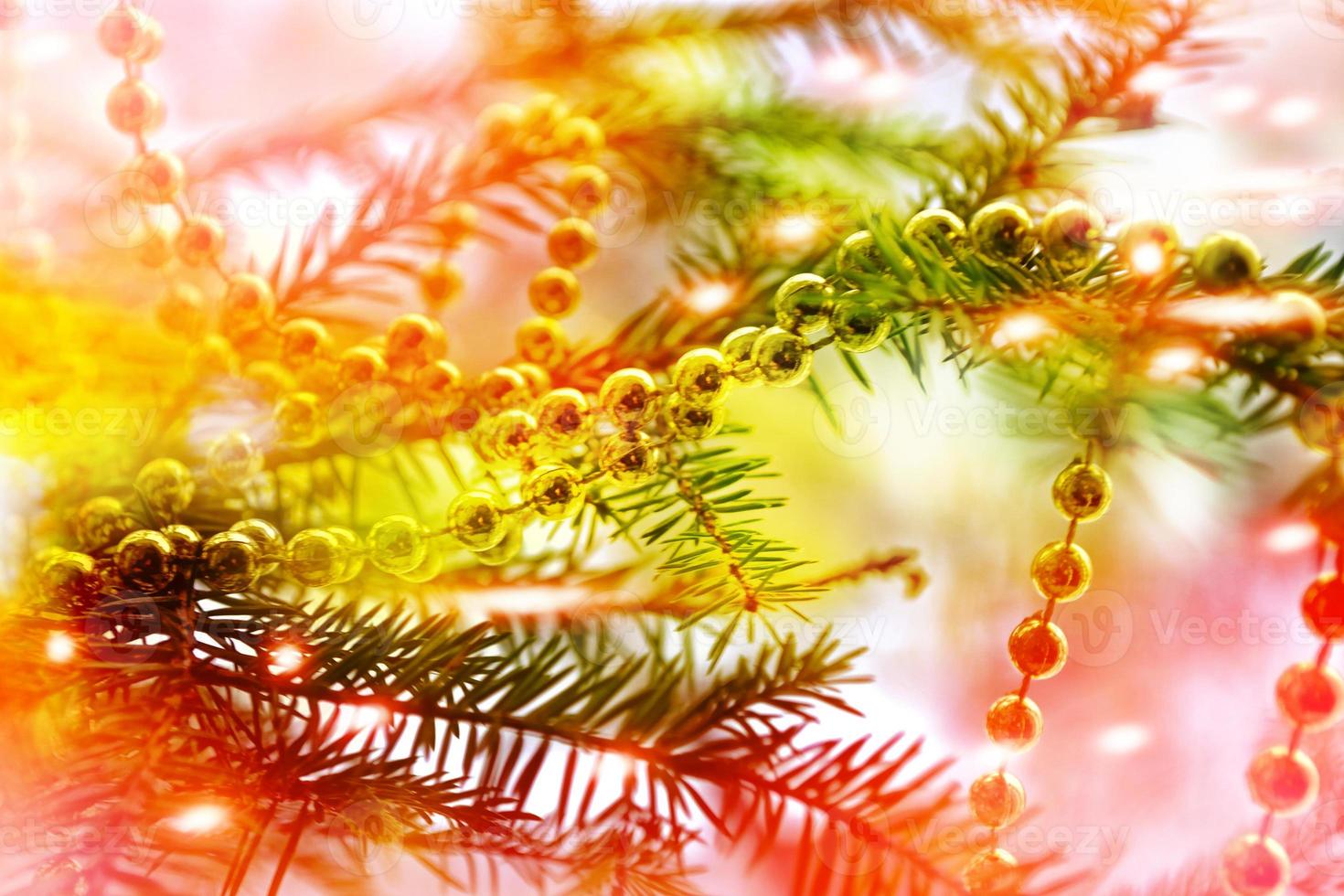 Christmas tree decorated with celebratory glass toys. photo