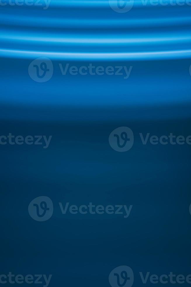 Abstract vertical background in blue tones with waves photo