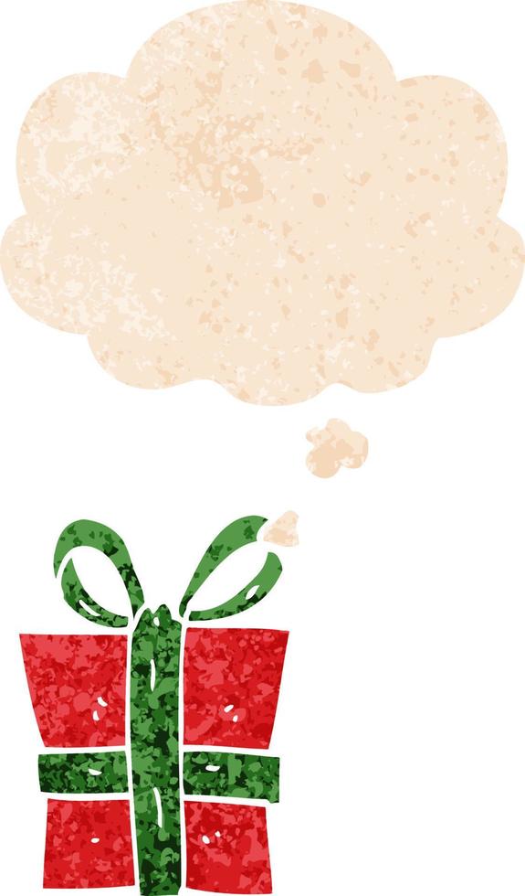cartoon gift and thought bubble in retro textured style vector