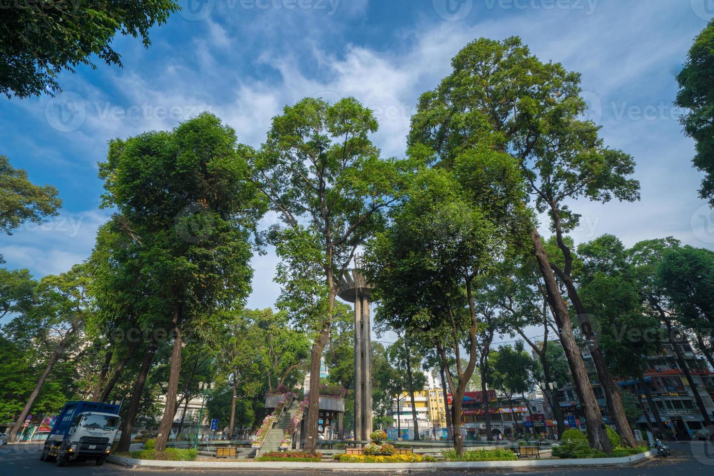 Wide angle view of Lotus pillar - An iconic architecture at Turtle lake , Ho Con Rua with blue sky in Saigon. photo