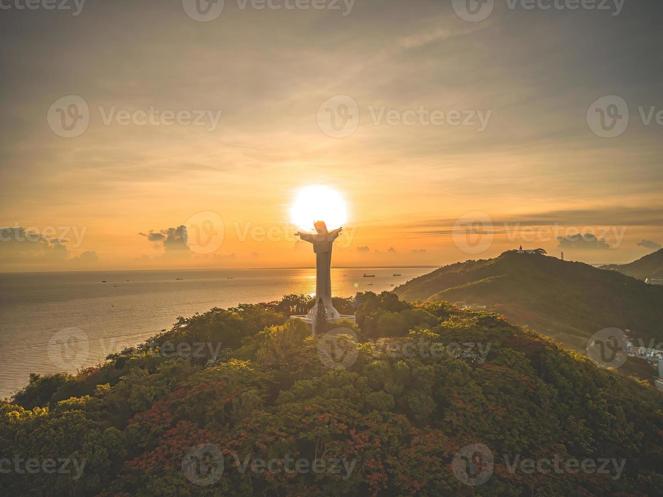 Top view of Vung Tau with silhouette statue of Jesus Christ on Mountain . the most popular local place. Christ the King, a statue of Jesus. Travel concept. photo