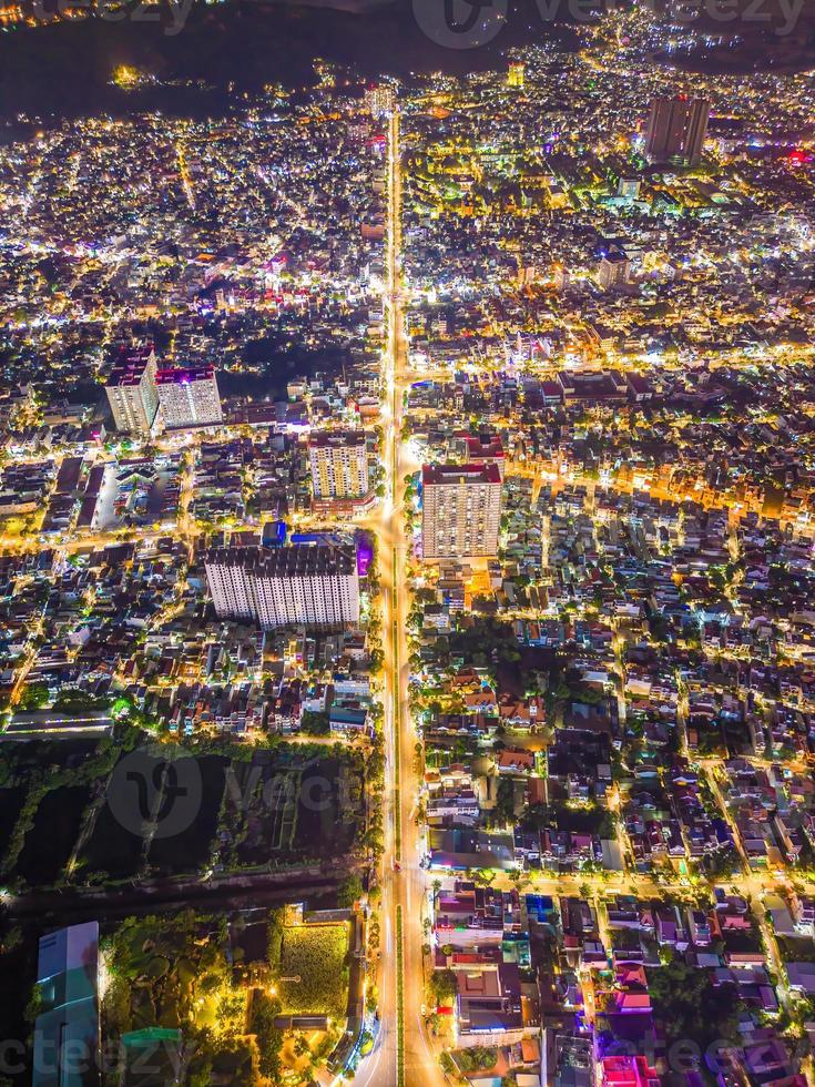 Vung Tau view from above, with traffic roundabout, house, Vietnam war memorial in Vietnam. Long exposure photography at night. photo