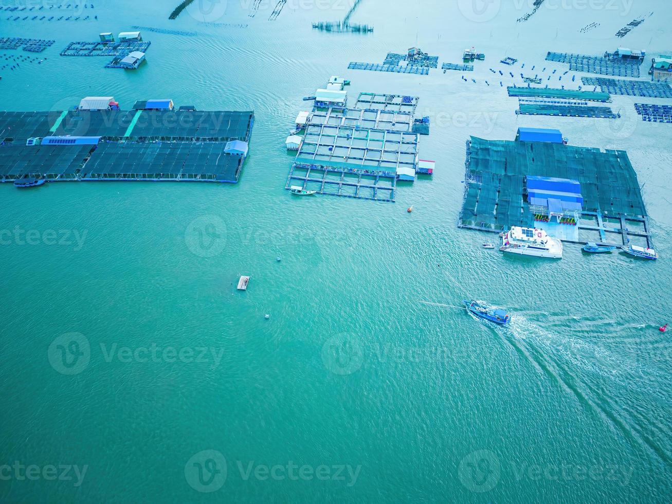 A corner of the oyster feeding farm, float fishing village in Long Son commune, Ba Ria Vung Tau province Vietnam. People living and doing feed fish industry at floating village. photo