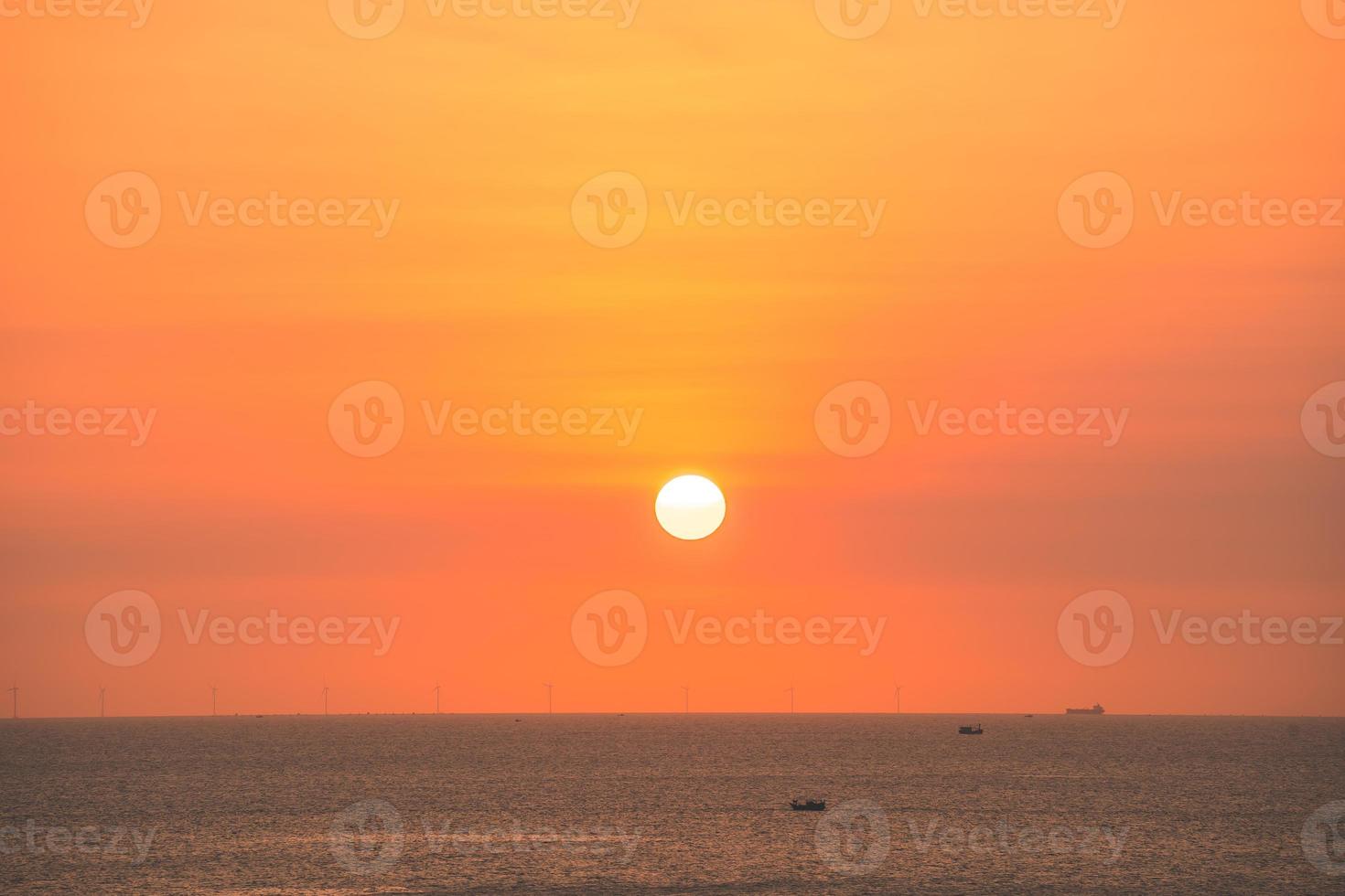 Beautiful sunset beach landscape, exotic tropical island nature, colorful red yellow sky, silhouette ship, golden sun glow reflection, summer holidays vacation. Sky cloud cinematic. photo