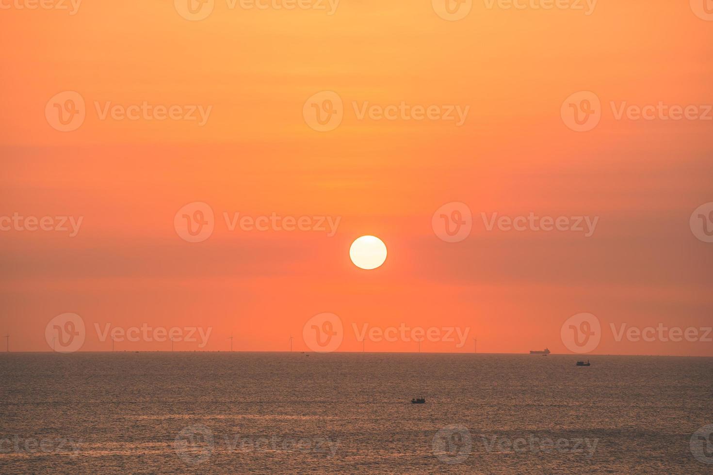 Beautiful sunset beach landscape, exotic tropical island nature, colorful red yellow sky, silhouette ship, golden sun glow reflection, summer holidays vacation. Sky cloud cinematic. photo