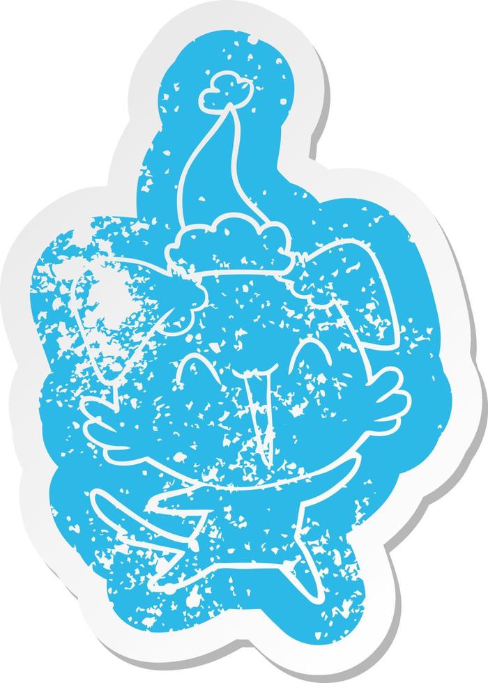 happy little dog cartoon distressed sticker of a wearing santa hat vector