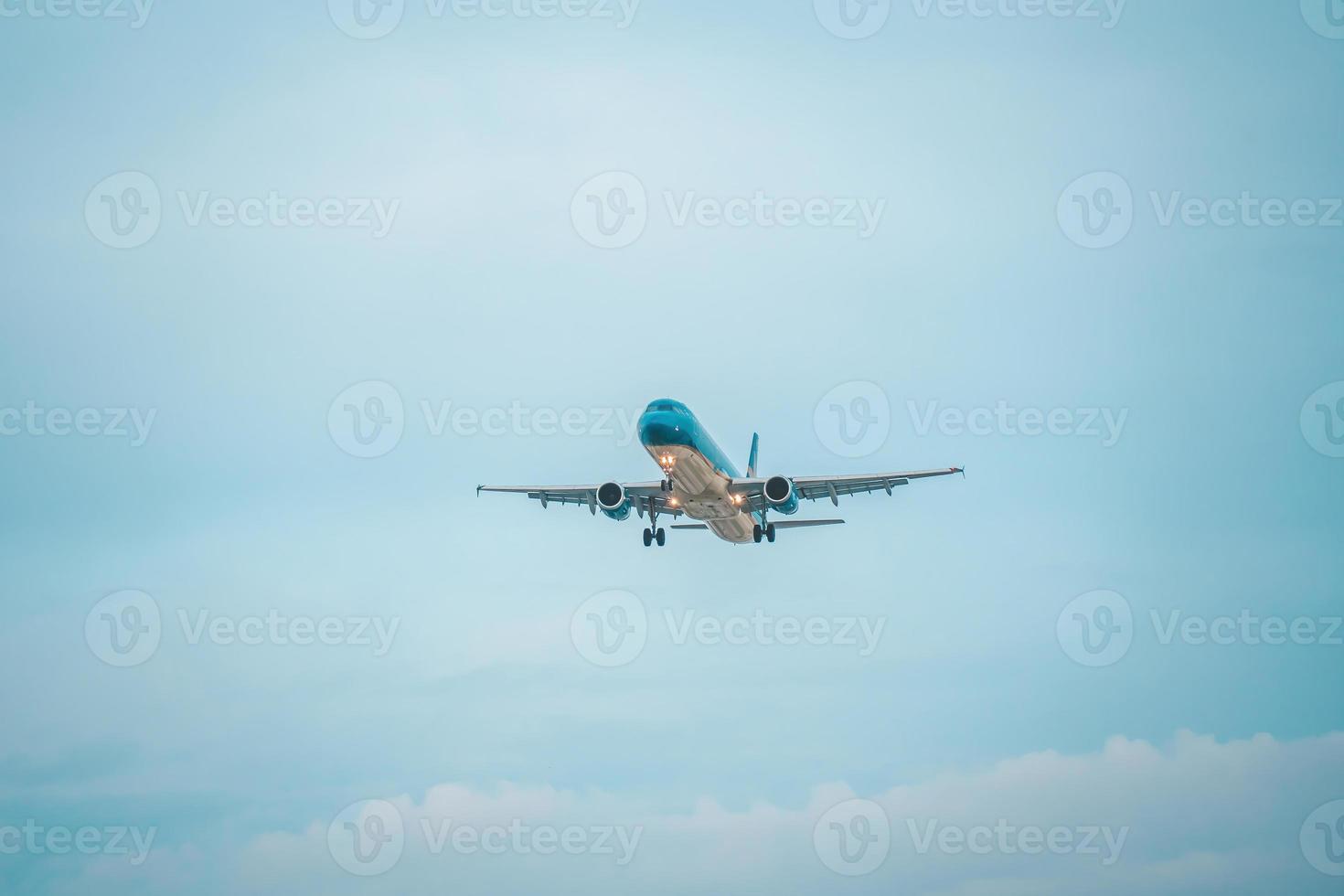 Ho Chi Minh city, Vietnam - FEB 12 2022 Airplane fly over urban areas preparing landing into Tan Son Nhat International Airport and takes off in TSN airport photo