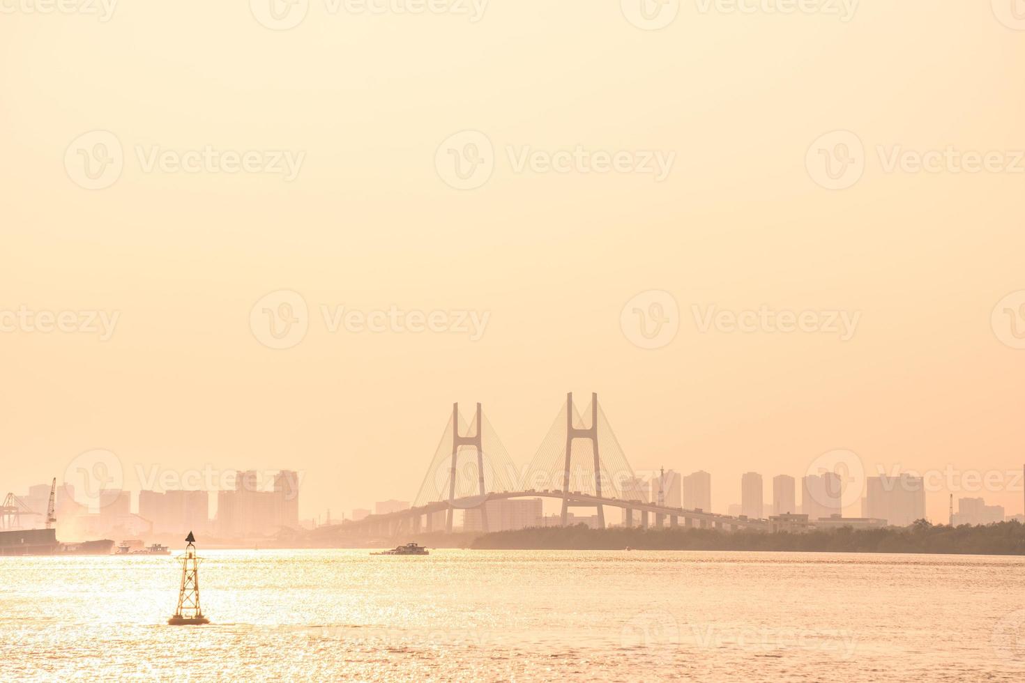 Ho Chi Minh, VIETNAM - FEB 19 2022 Transportation for export, import at Cat Lai port on Sai Gon river, crane load container to boat, this harbor is big industry service for trade photo