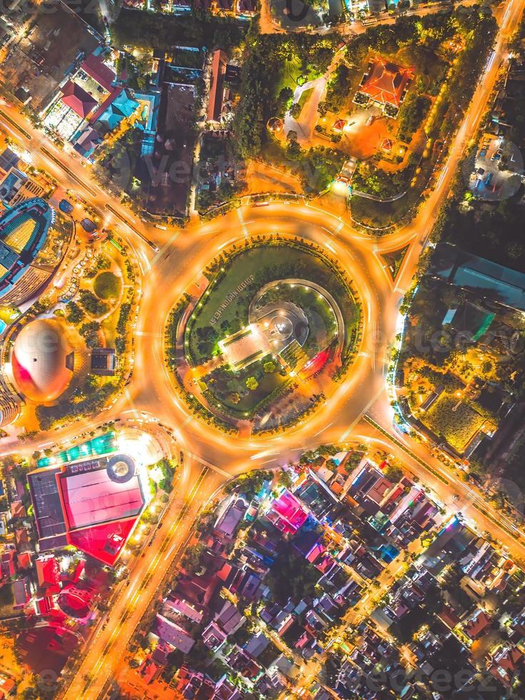 Vung Tau view from above, with traffic roundabout, house, Vietnam war memorial in Vietnam. Long exposure photography at night. photo