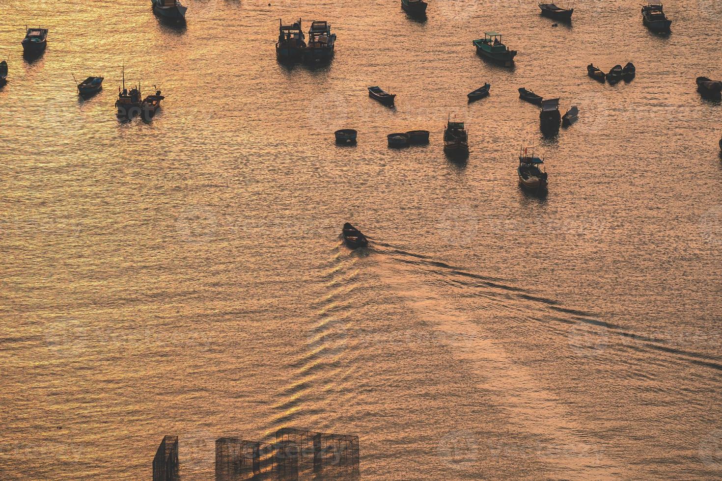 Aerial view many local culture Vietnam. Top view of local fisherman boats in the deep blue sea, tropical seascape. Travel destination Asia concept and background. photo