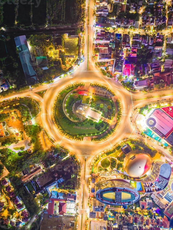 Vung Tau view from above, with traffic roundabout, house, Vietnam war memorial in Vietnam. Long exposure photography at night. photo