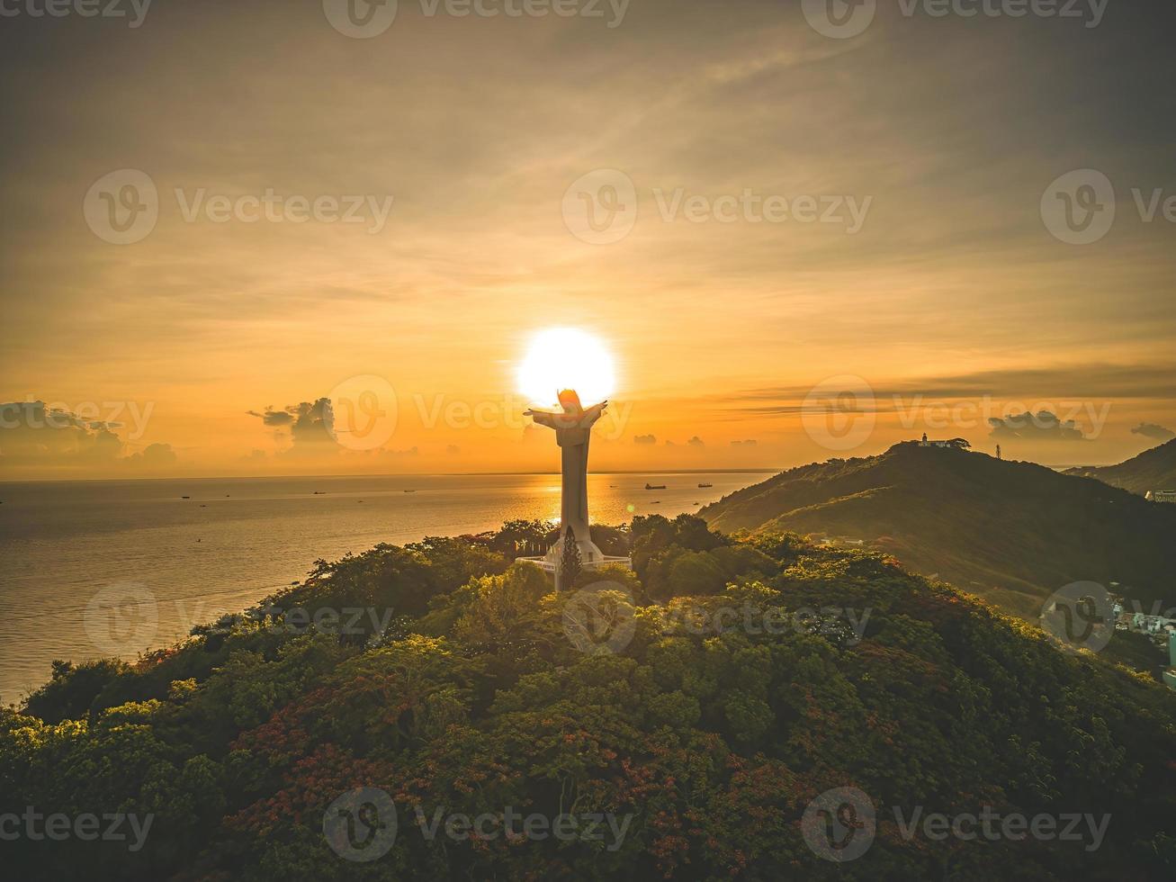 Top view of Vung Tau with silhouette statue of Jesus Christ on Mountain . the most popular local place. Christ the King, a statue of Jesus. Travel concept. photo
