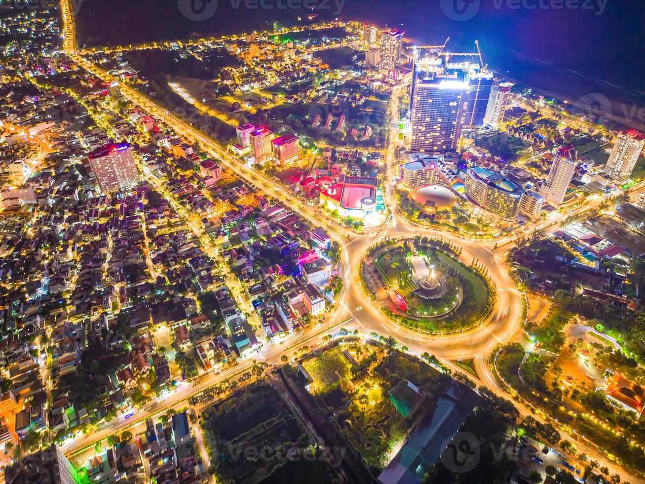 Vung Tau view from above, with traffic roundabout, house, Vietnam war memorial in Vietnam. Long exposure photography at night. photo