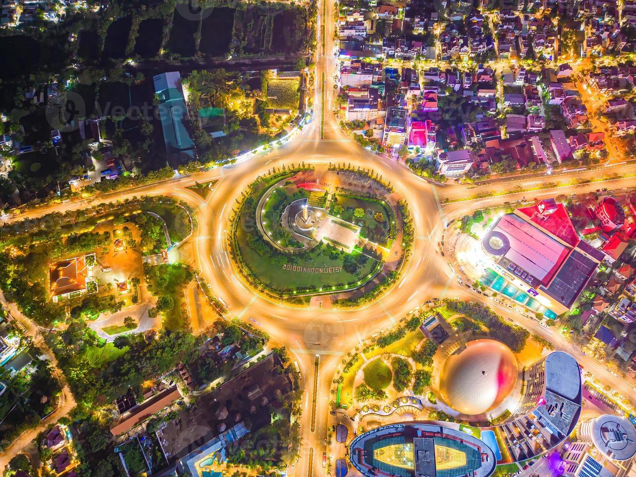 Vung Tau view from above, with traffic roundabout, house, Vietnam war memorial in Vietnam. Long exposure photography at night. photo