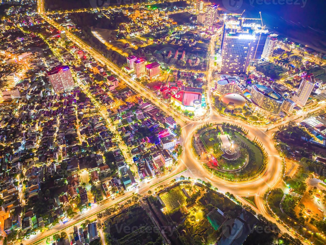 Vung Tau view from above, with traffic roundabout, house, Vietnam war memorial in Vietnam. Long exposure photography at night. photo