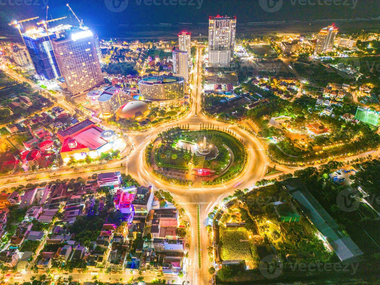 Vung Tau view from above, with traffic roundabout, house, Vietnam war memorial in Vietnam. Long exposure photography at night. photo